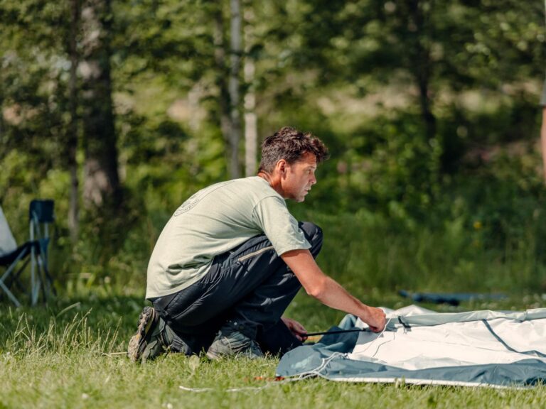 Man setting up a tent in Sweden